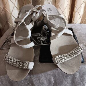 Anne Klein tan strappy wedge Sandals with metal hardware in size 9M.